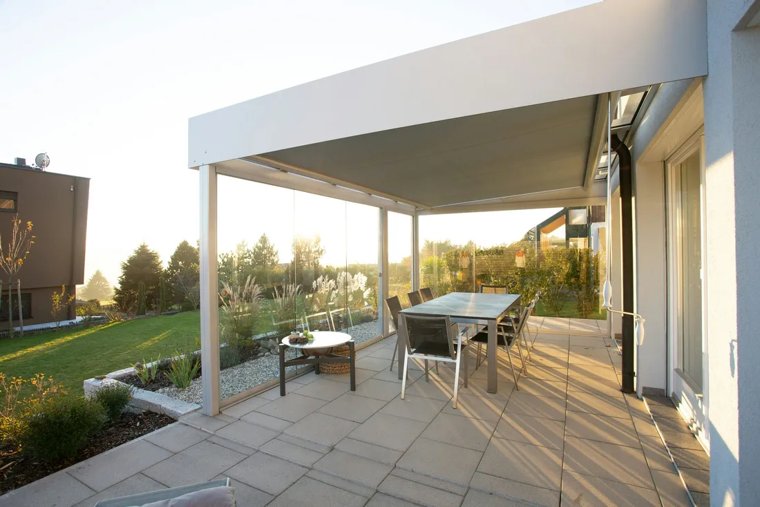 Modern insulated patio cover with glass wind-break panels — illustrative stock photo, not an actual Las Vegas installation.